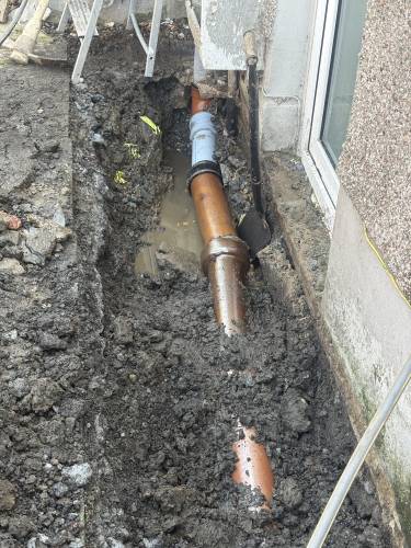 TikTok carousel cover showing drain repair work